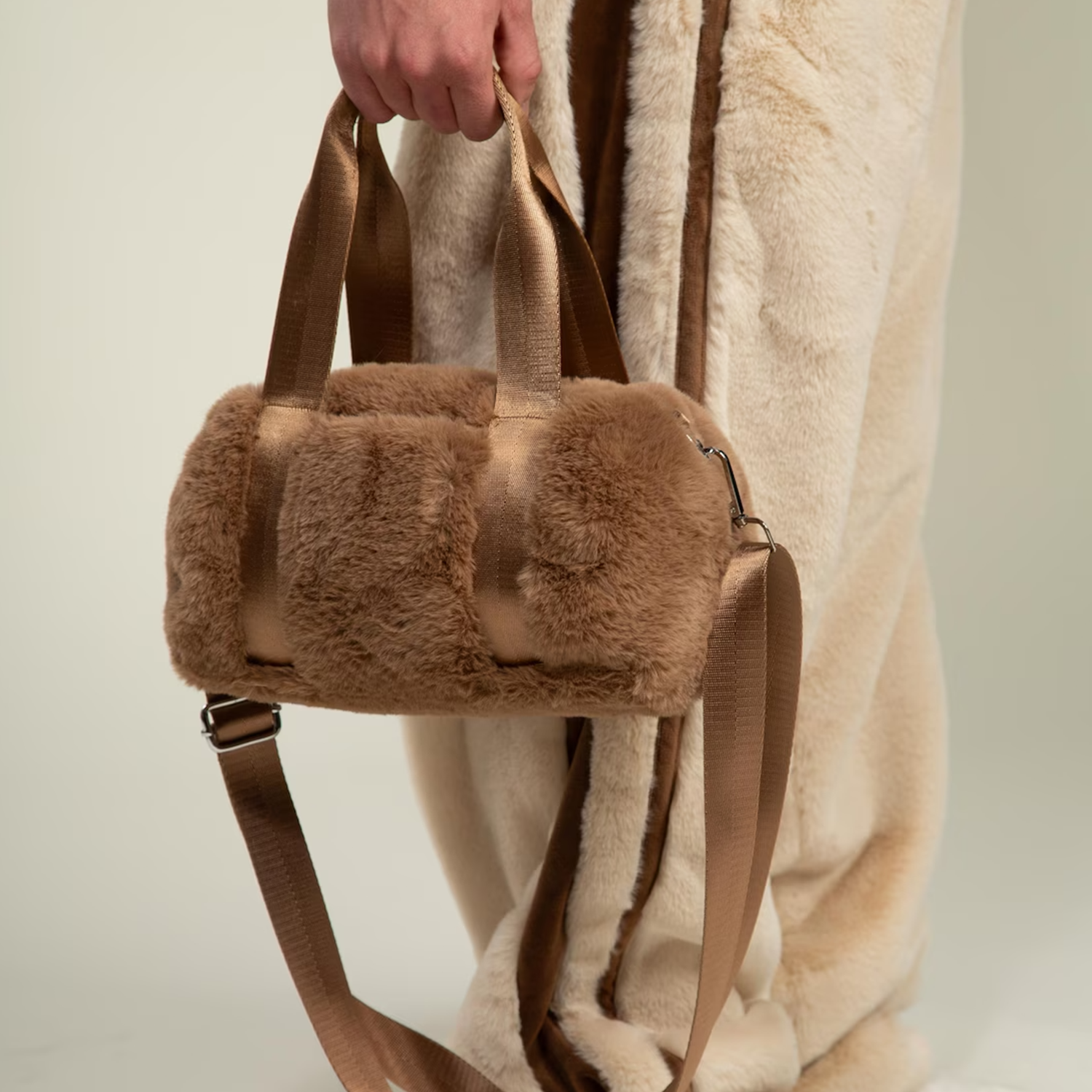 Tri-Tone Plush Fuzzy Cylindrical Mini Duffel With Woven Fabric Carry Grips, Detachable Matching Shoulder Band And Reinforced Lined Inner Storage
