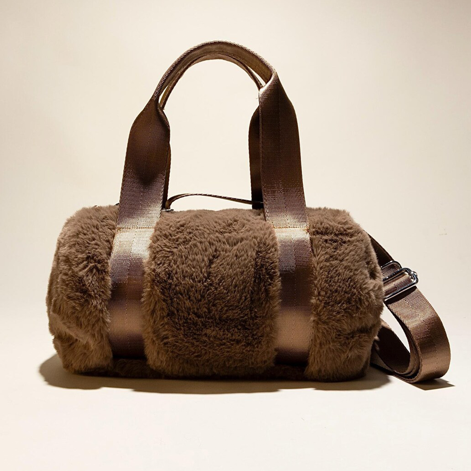 Tri-Tone Plush Fuzzy Cylindrical Mini Duffel With Woven Fabric Carry Grips, Detachable Matching Shoulder Band And Reinforced Lined Inner Storage