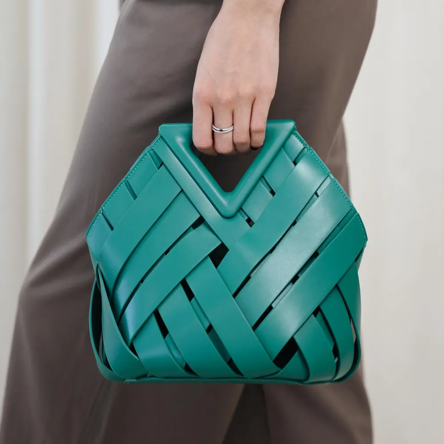 Multi-Tone Wide-Strip Woven Geometric Handbag With Angular V-Cut Top Grip, Structured Contoured Frame And Convertible Carry Function
