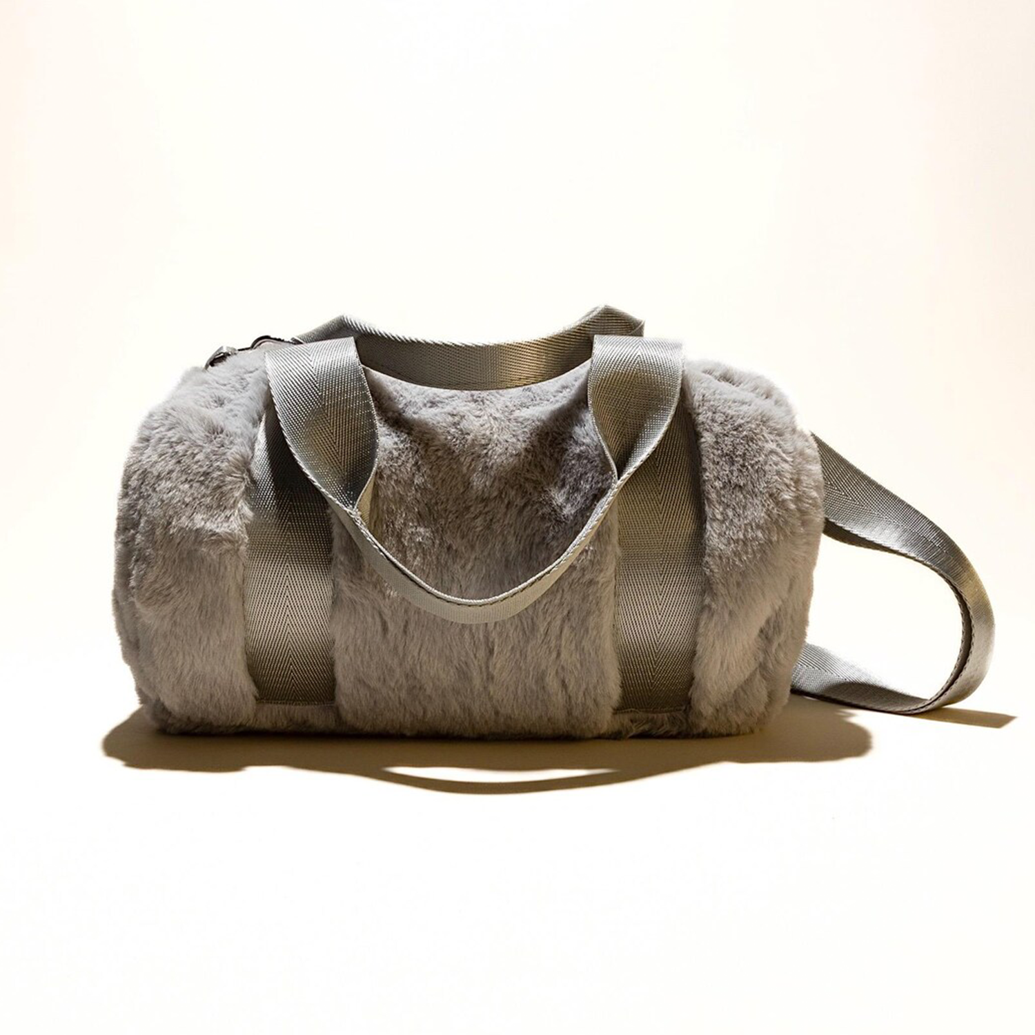 Tri-Tone Plush Fuzzy Cylindrical Mini Duffel With Woven Fabric Carry Grips, Detachable Matching Shoulder Band And Reinforced Lined Inner Storage